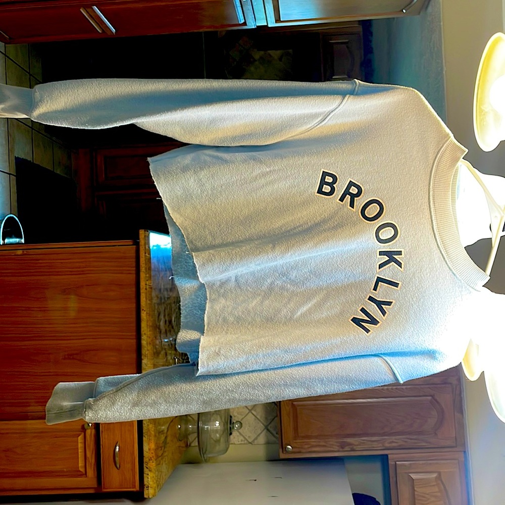 Blue crop sweater with Brooklyn on front from forever 21